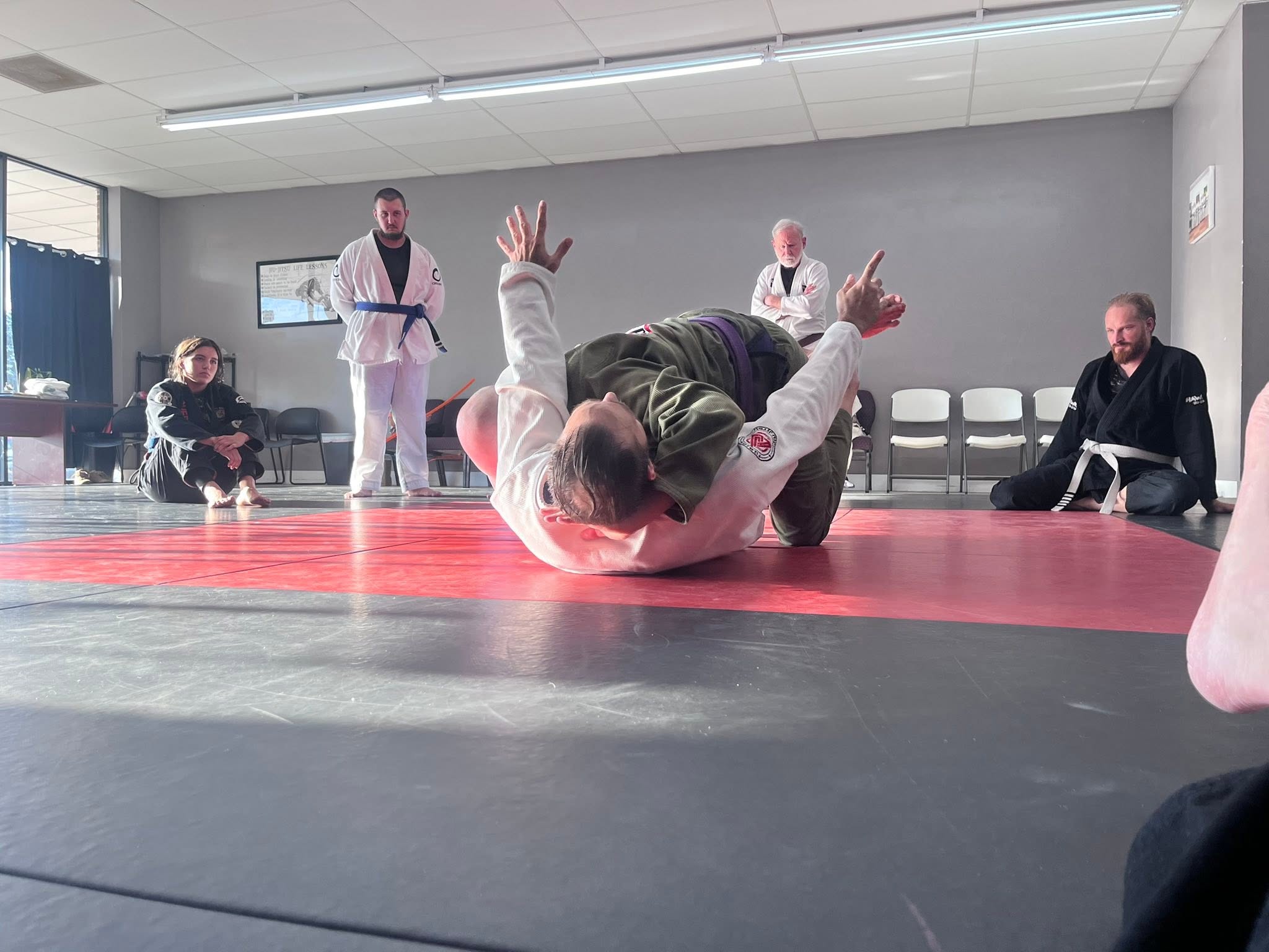 A ground technique in motion during class at Fusion Jiu Jitsu in Forest City